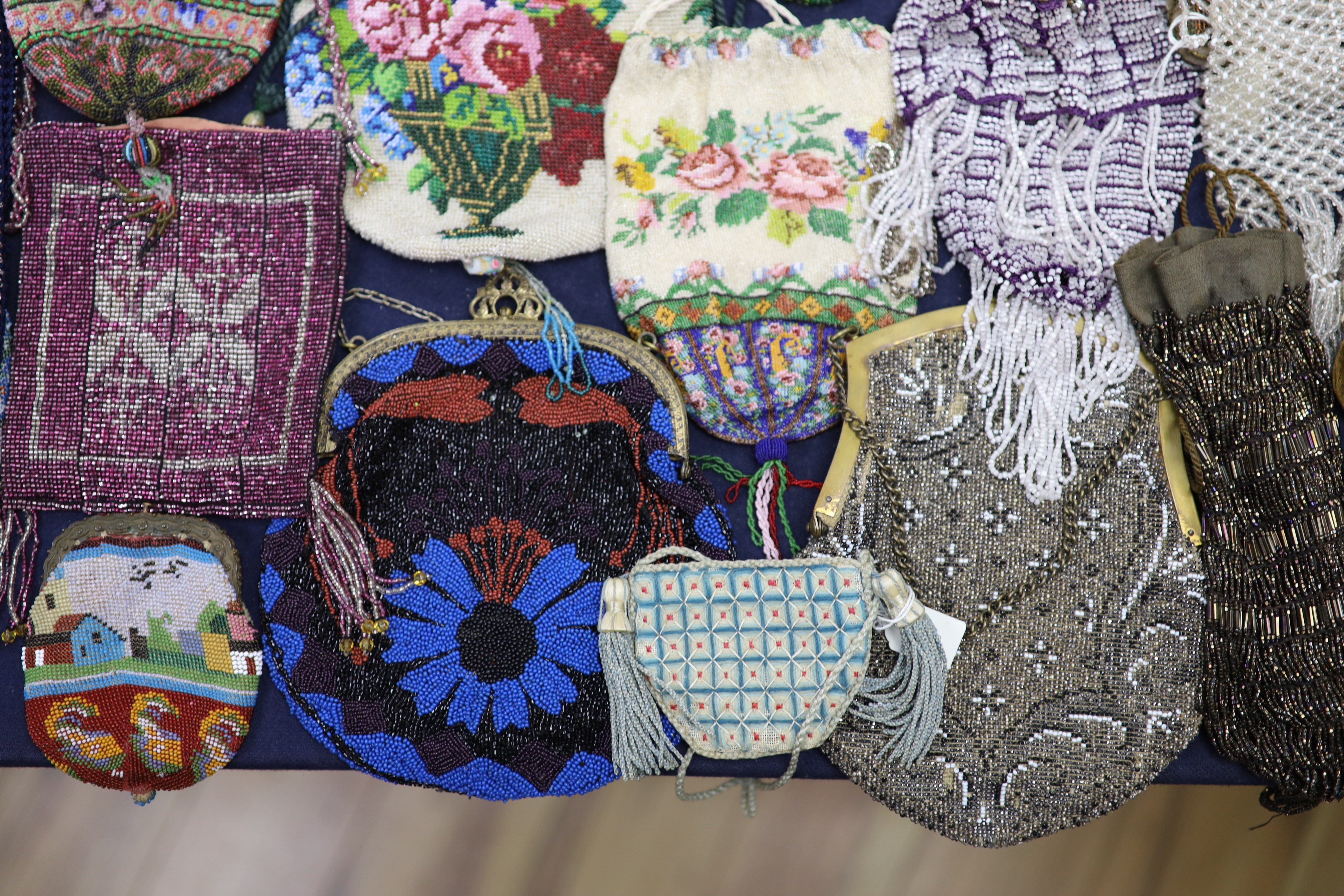 A collection of approximately fifty Victorian and later beadwork, white metal and fabric purses etc.